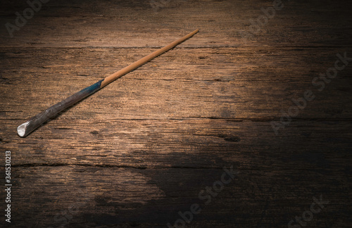 Magic wand on wooden table, Magic wand Wizard tool on vintage wooden background.