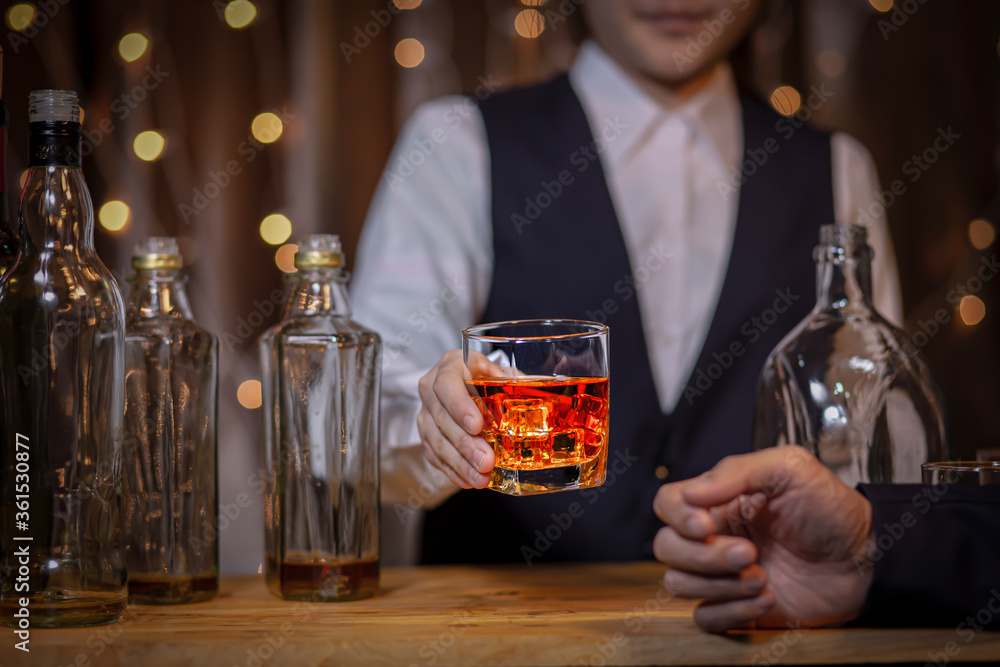 Bartender Serve Whiskey, on wood 