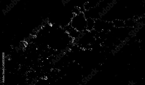 Splashes and drops of water are on a black background.