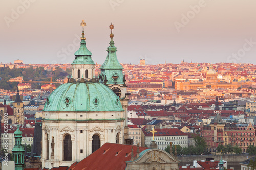 Close up of St. Nicholas church of Lesser town of Prague viewed from Prague castle during twilight