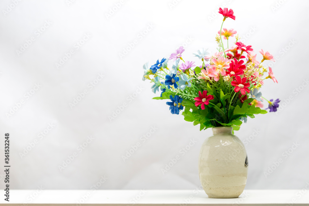bunch of plastic flowers in vase bunch of plastic flowers in vase