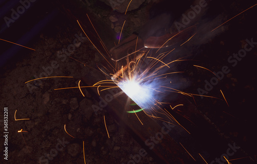 sparks from metal welding at a construction site