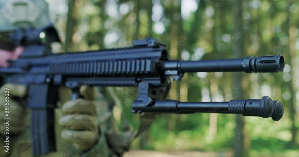 Soldiers aiming assault rifle and protecting military base Soldiers aiming assault rifle and protecting military base