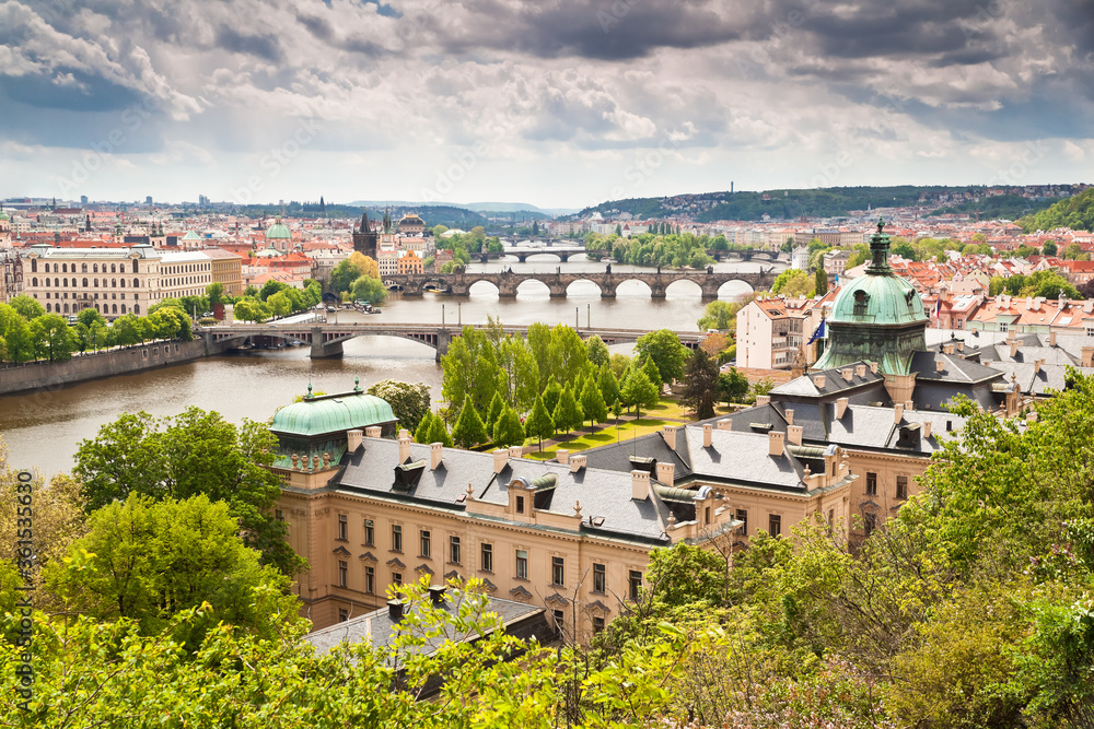 Beautiful view of Vltava river, Prague's bridges, Old town and the seat of czech government at the building of Straka academy in the foreground