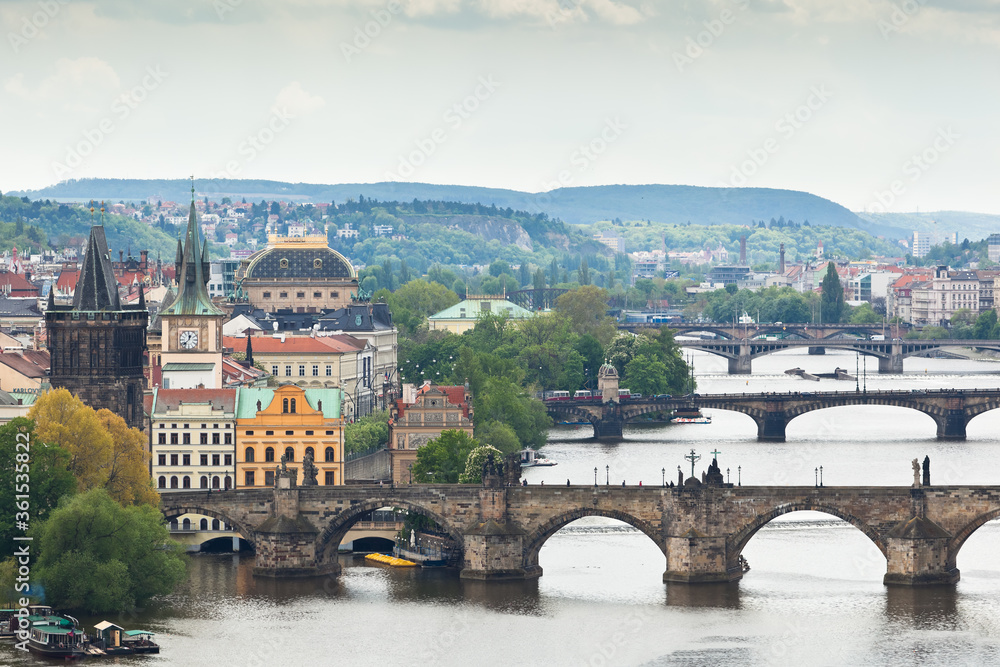 Some of Prague's bridges over Vltava river along with some Old town towers