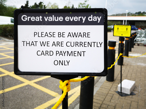 Sign informing customers of Card Payment Only and No Cash Purchases - for safety and self distancing as shops re-open during the COVID-19 Pandemic in UK photo