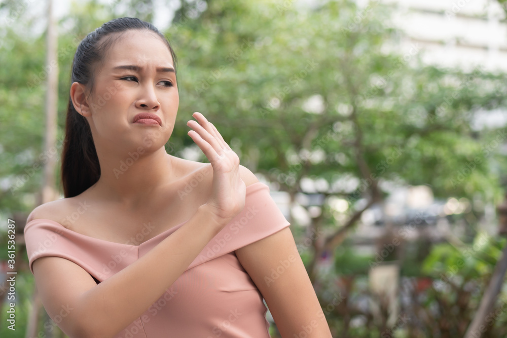rejecting woman saying stop, no, halt with hand gesture rejecting woman saying stop, no, halt with hand gesture