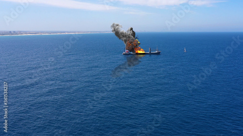 Cargo ship burning on fire with large scale smoke-Aerial Aerial, Mediterranean Sea, Cargo tanker ship, Real Drone view with visual effect Elements 