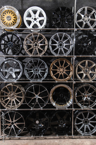 wall of alloy wheels in the store. Auto repair shop background. Auto Wheel Service.