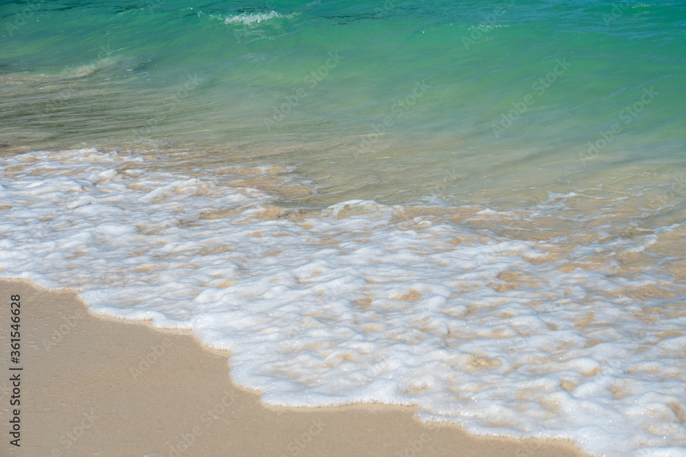 Backgrounds of quiet clear clean water sea white sand beach in summer holiday in Thailand