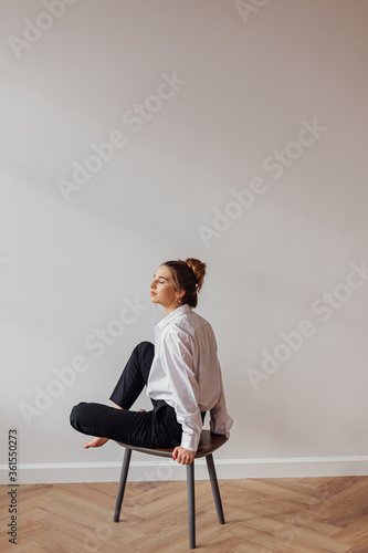 Portrait of a girl sitting on a chair