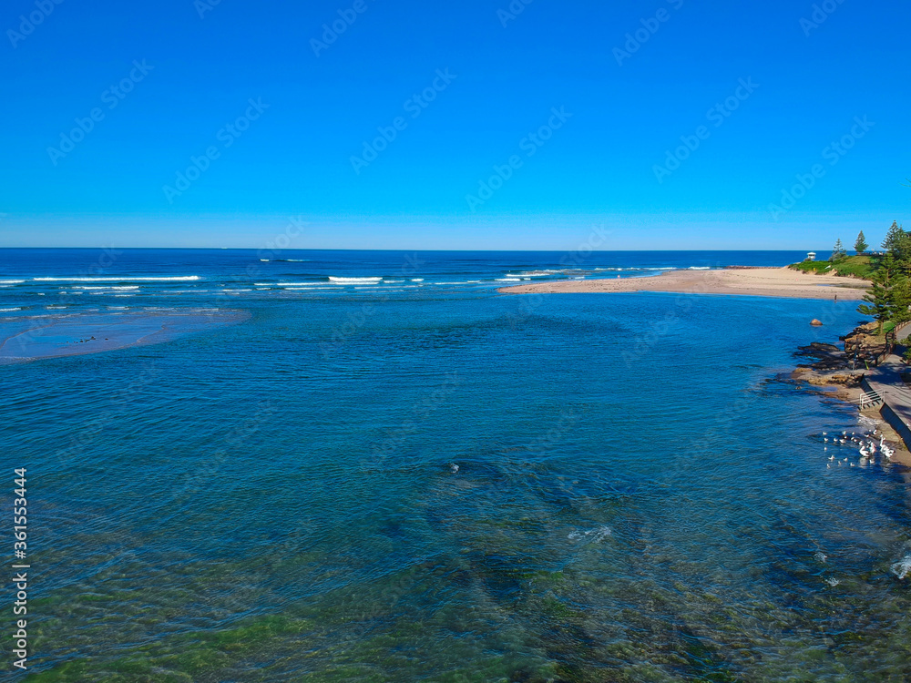Drone Aerial view of The Entrance NSW Australia blue bay waters great beach and sandy bars