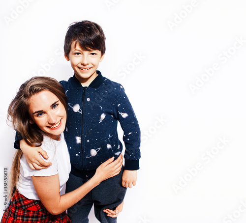 lifestyle and people concept, little cute boy with teenage girl posing together cheerful happy smiling isolated on white background