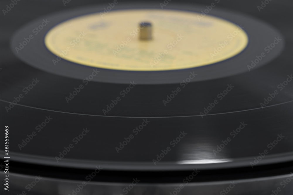 Playing a black vinyl record, selective focus. Playing a black vinyl record, selective focus.