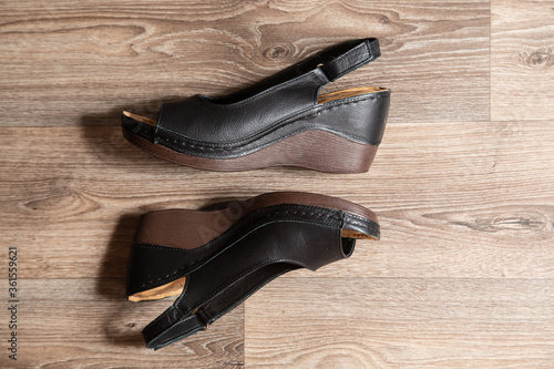 black women shoes on wooden background