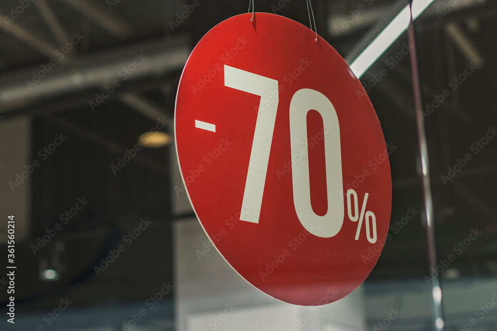 Banner in the mall with a 70% discount on a red background.