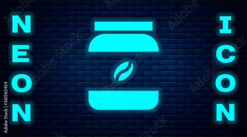 Glowing neon Coffee jar bottle icon isolated on brick wall background. Vector Illustration.