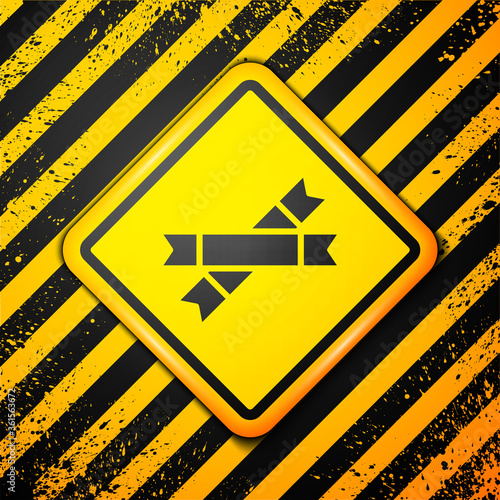 Black Sugar stick packets icon isolated on yellow background. Blank individual package for bulk food products as coffee, salt, spices. Warning sign. Vector Illustration.