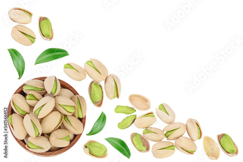 Wallpaper Mural pistachio in wooden bowl isolated on white background . Top view with copy space for your text. Flat lay Torontodigital.ca