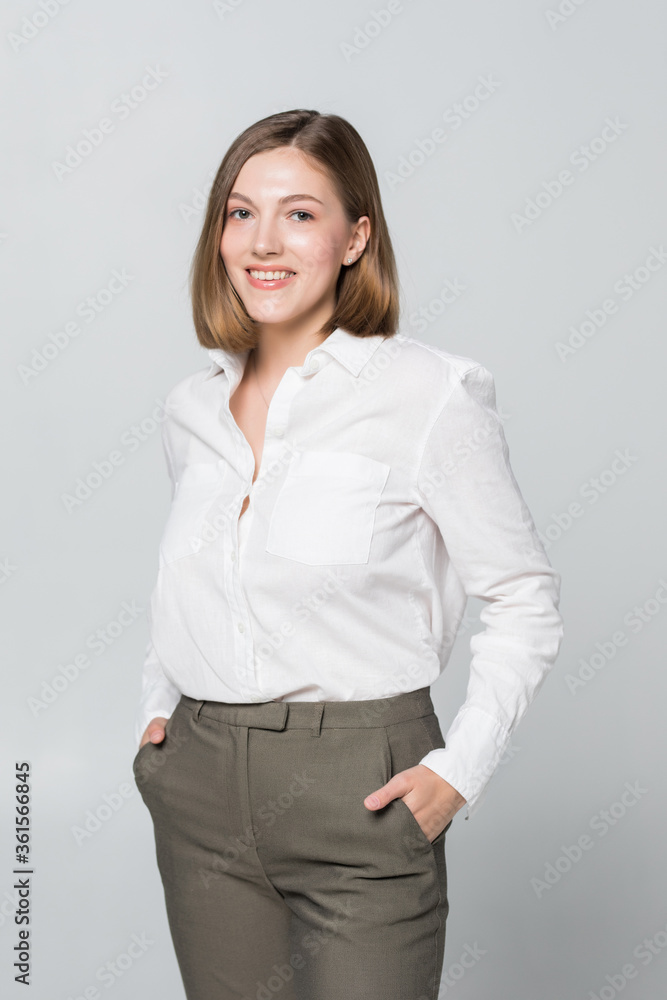 Smiling business woman with folded hands against white background. Smiling business woman with folded hands against white background.
