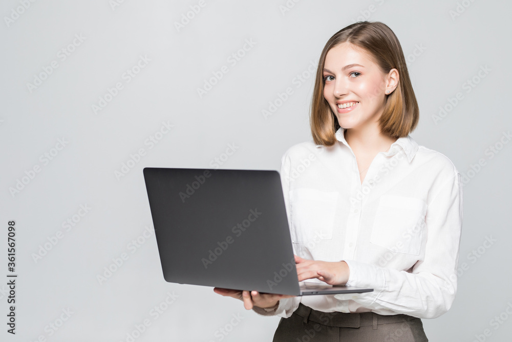 Attractive businesswoman with laptop against white background Attractive businesswoman with laptop against white background