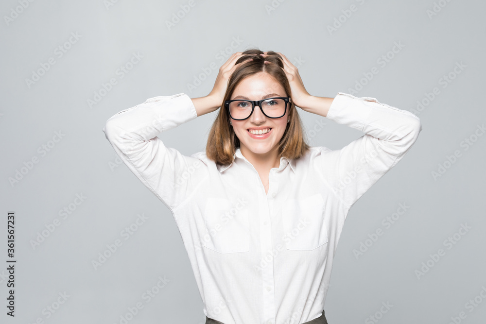 Portrait of unhappy young businesswoman holding hands in head isolated on white background Portrait of unhappy young businesswoman holding hands in head isolated on white background