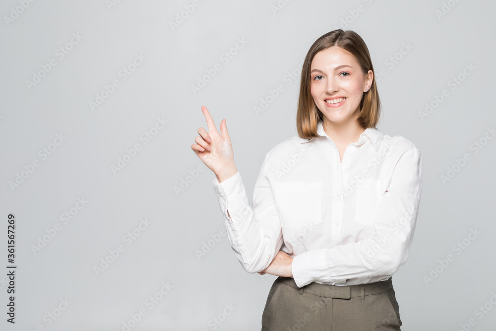 Businesswoman smile point finger to empty copy space isolated over white background. Business woman showing pointing side, concept of advertisement product.