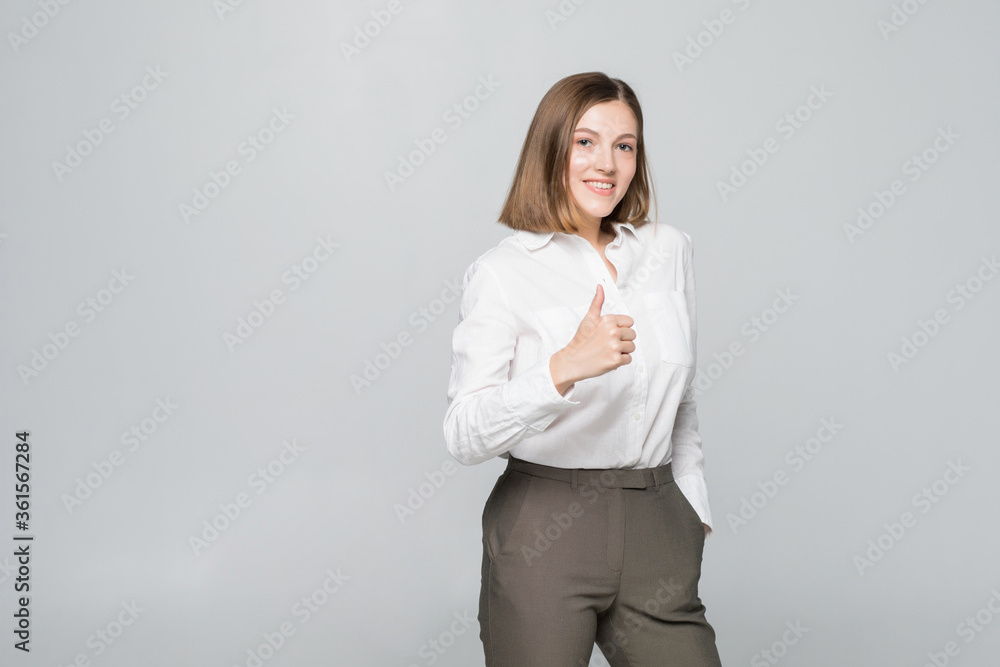 Happy smiling business woman with thumbs up gesture on white background Happy smiling business woman with thumbs up gesture on white background