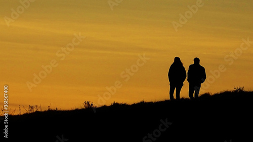 Couple walking in the sunset