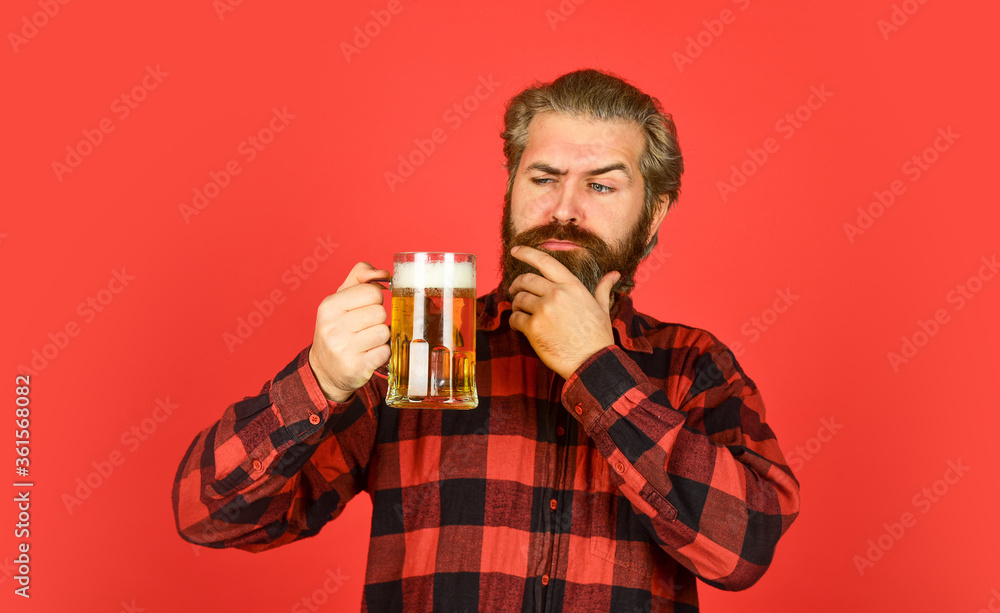 brew house. mature bearded barman hold beer glass. confident bartender raising toast. leisure and celebration. Man drinking beer in pub bar. Beer with foam. brutal hipster drink beer brew house. mature bearded barman hold beer glass. confident bartender raising toast. leisure and celebration. Man drinking beer in pub bar. Beer with foam. brutal hipster drink beer