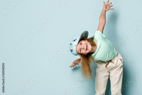 Fényképezés Kid in t-shirt, pants and cap printed by pineapples