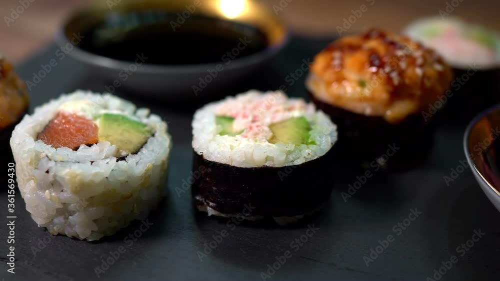 Sushi roll set on the black plate. Japanese food. Sushi roll set on the black plate. Japanese food.