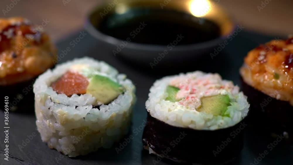 Sushi roll set on the black plate. Japanese food. Sushi roll set on the black plate. Japanese food.