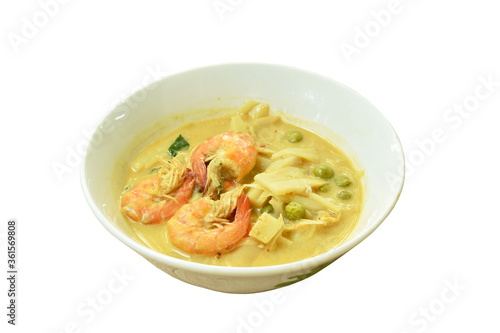 spicy boiled slice pickled bamboo shoot with shrimp and eggplant in coconut milk curry soup on bowl