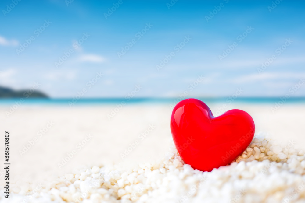 colorful eggs with summer text on white sand beach over blue background for summer holiday concept. colorful eggs with summer text on white sand beach over blue background for summer holiday concept.