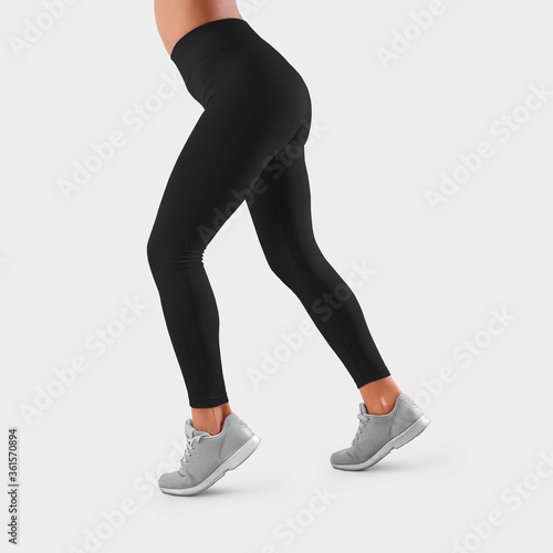 Template of black tight-fitting sweatpants on the taut legs of a girl, running, side view.