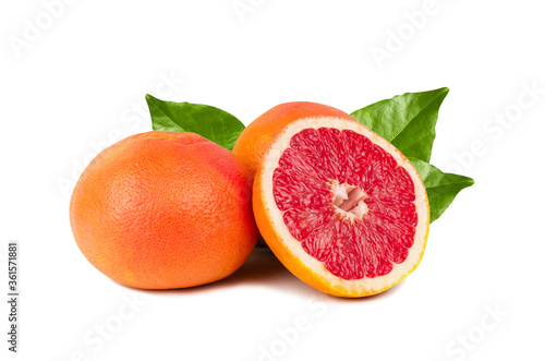 Composition of three red grapefruits with green leaves on. Two whole grapefruits and one cut in half. Grapefruit isolated on a white background. Citrus, orange, juicy, tasty, tropical fruit.