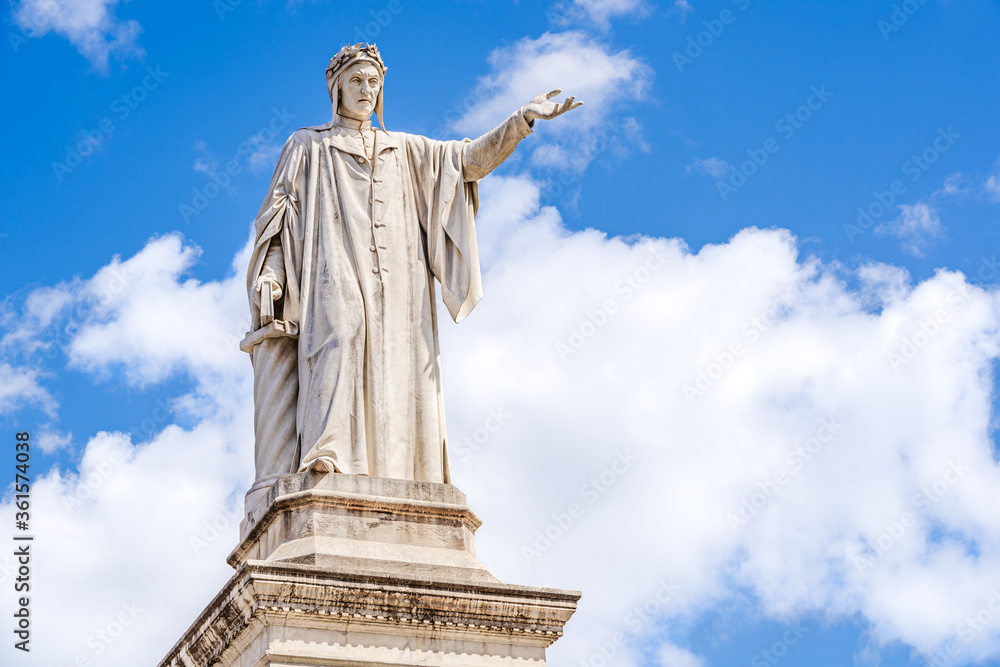 Monument to Dante Alighieri a 19th-century statue of the poet Dante sculpted by Tito Angelini located in Plazza Dante Naples, Italy
