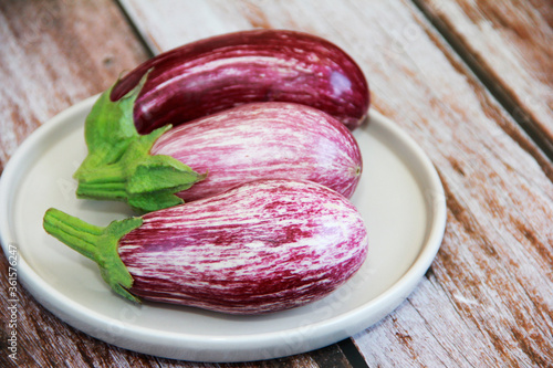 natural striped vegetable eggplant on a decorative plate