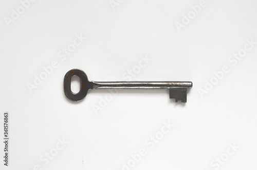 the key to the front door. metal key on a white background. © Alena Mostovich