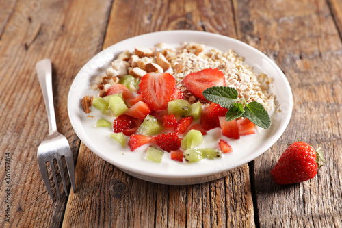 cereal with milk, nuts and ffresh fruits photo