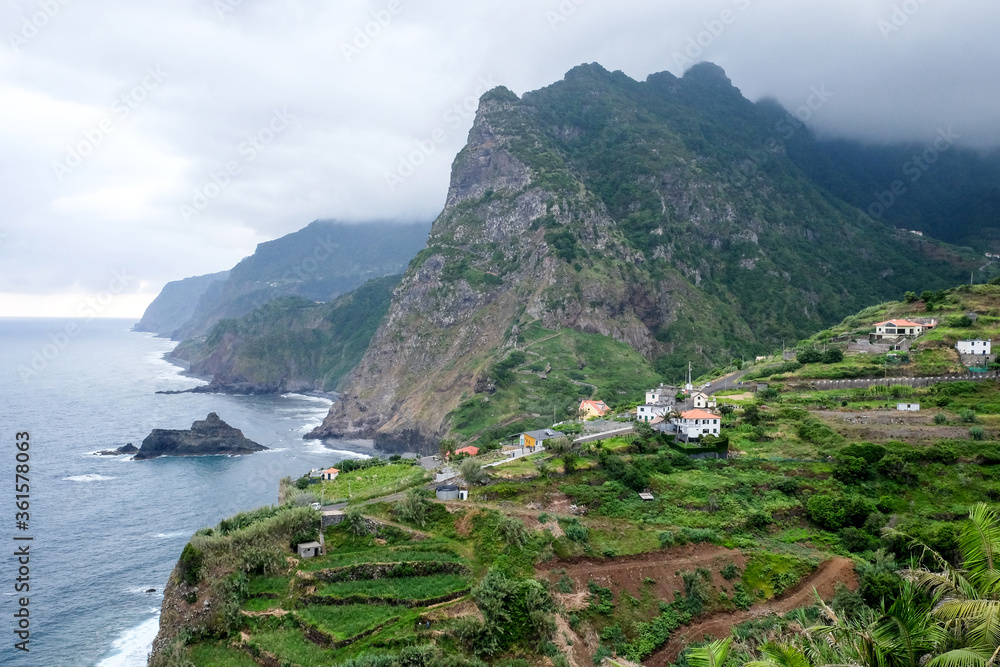 The morning fog on the beautiful rocky coast of Atlantic ocean on Madeira island