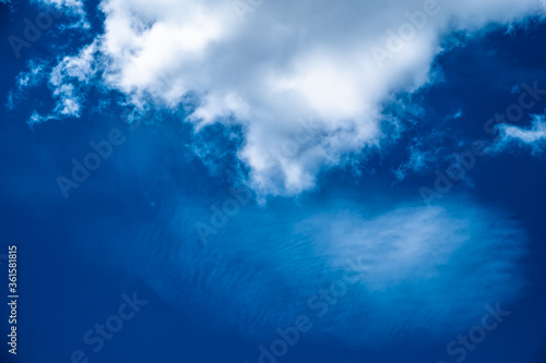 Blue sky with clouds. Background of lovely blue sky with white stratus clouds. 