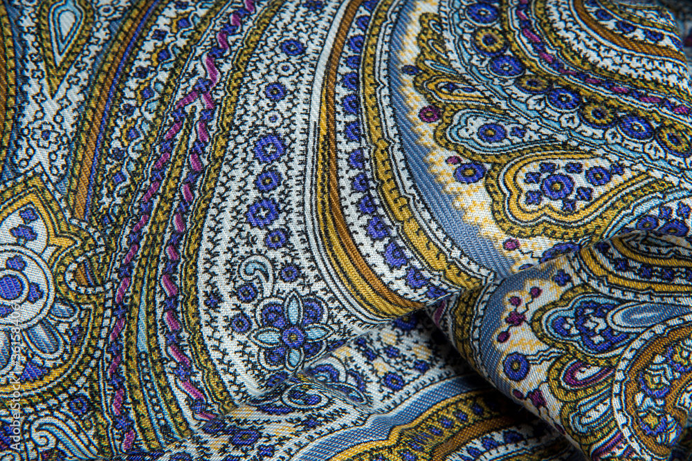 top view closeup on crumpled soft cotton scarf with bright oriental ornament top view closeup on crumpled soft cotton scarf with bright oriental ornament