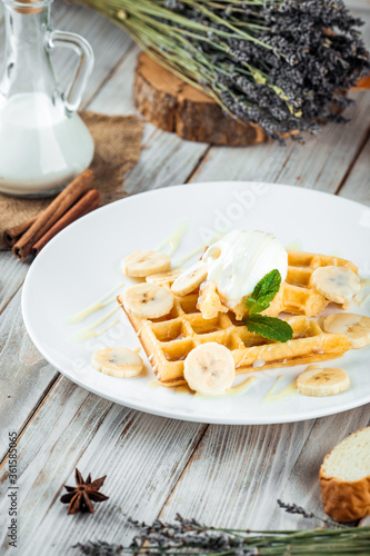 Belgian waffles poured with ice cream banana