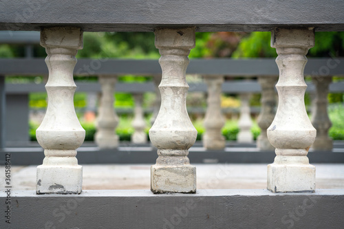 Close-up at row of stone pillar balcony of walkway in European luxury mansion. Gardening outdoor decoration object photo.