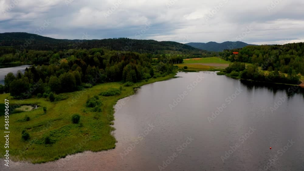 Air shot with a drone from Bogstadvannet, Oslo, Norway. Flying near the water at high speed. Shot in 4k or UHD. Air shot with a drone from Bogstadvannet, Oslo, Norway. Flying near the water at high speed. Shot in 4k or UHD.