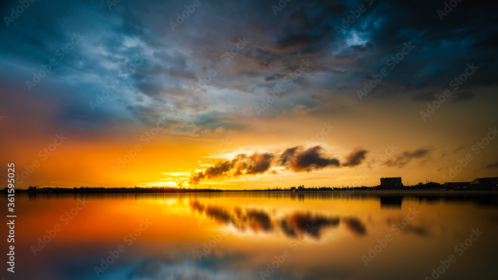 beautiful sunset golden time with industry smoke and water reflection beautiful sunset golden time with industry smoke and water reflection