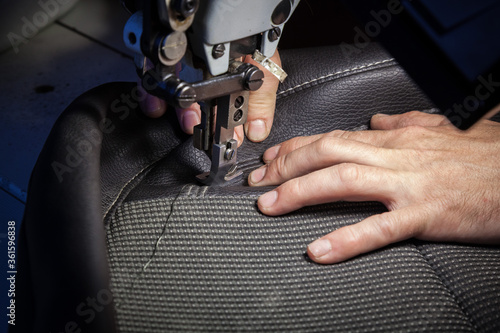 Tailoring of leather products. Repair of the car seat cover.