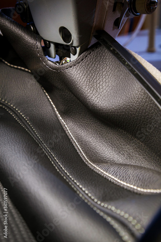 Tailoring of leather products. Repair of the car seat cover.